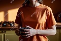 Orange t shirt mockup holding mug image Product Image 1