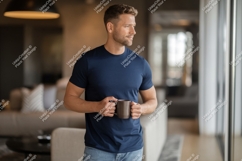 Man holding mug in modern interior navy t-shirt Product Image 1