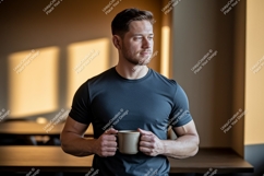 Man holding coffee mug indoors casual Product Image 1