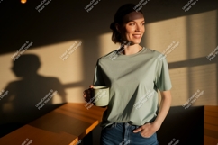 Woman holding mug in sunlit room coffee casual Product Image 1
