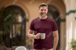 Man wearing maroon t shirt holding mug image Product Image 1