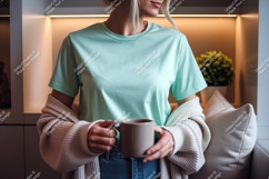 Woman wearing mint t shirt holding coffee mug mockup Product Image 1