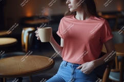 Woman wearing coral t shirt holding coffee cup image Product Image 1