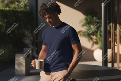 Man wearing dark blue t shirt holding mug Product Image 1
