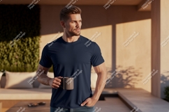 Man wearing navy t-shirt holding mug Product Image 1