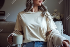 Woman wearing cream t shirt holding mug image Product Image 1