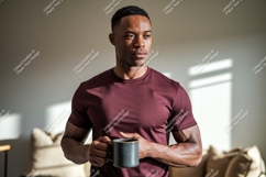 Man holding coffee mug indoors casual Product Image 1