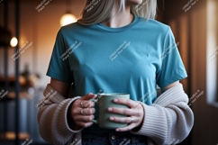 Woman wearing teal t shirt holding mug image Product Image 1