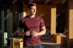 Man wearing maroon t shirt holding mug t-shirt Product Image 1