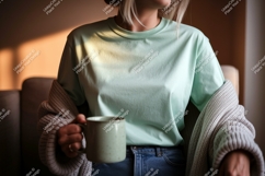 Woman wearing mint t shirt holding mug image Product Image 1