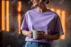 Woman wearing purple t shirt holding mug image Product Image 1