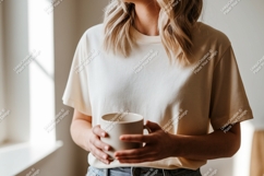Cream T-Shirt Mockup Holding Coffee Mug Product Image 1
