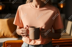 Peach shirt person holding mug image Product Image 1