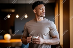 Man holding mug looking out window image Product Image 1