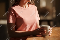Peach shirt woman holding mug image Product Image 1