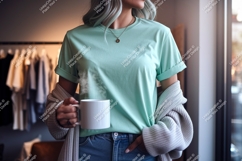 Woman wearing mint t shirt holding coffee mug image Product Image 1