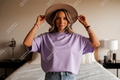 Woman wearing lavender t shirt and hat t-shirt casual Product Image 1