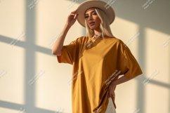 Woman wearing mustard t shirt and hat fashion Product Image 1