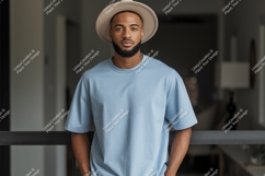 Man wearing light blue t-shirt and hat fashion Product Image 1