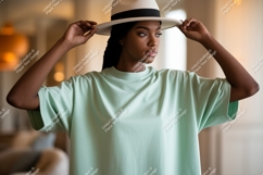 Woman wearing light green t-shirt and white hat mockup Product Image 1