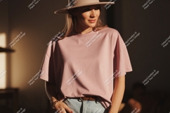 Woman wearing pink t-shirt and hat casual Product Image 1