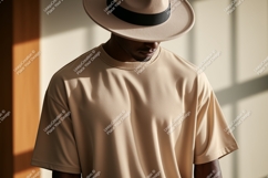 Man wearing beige t shirt and hat image Product Image 1