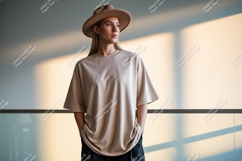 Woman wearing oversized beige t shirt and hat image Product Image 1