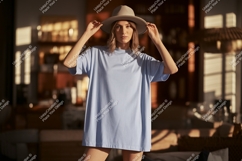 Woman wearing light blue t shirt and hat image Product Image 1