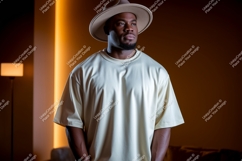 Man wearing light colored t shirt and hat Product Image 1