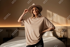 Woman wearing beige t shirt and hat image Product Image 1