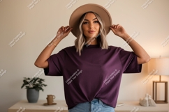 Woman wearing plum t shirt and hat t-shirt casual Product Image 1