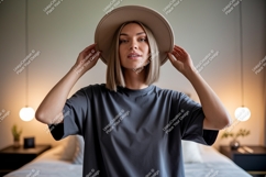 Woman wearing hat and grey t shirt image Product Image 1
