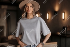 Woman wearing grey t shirt and hat t-shirt fashion Product Image 1
