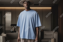 Young man wearing light blue t-shirt and hat fashion Product Image 1