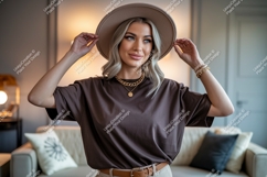 Woman wearing brown t shirt and hat t-shirt gold Product Image 1