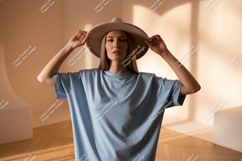 Woman wearing light blue t shirt and hat t-shirt fashion Product Image 1