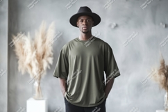 Man wearing olive green t-shirt and black hat image Product Image 1