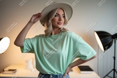 Woman wearing mint green t-shirt and hat image Product Image 1