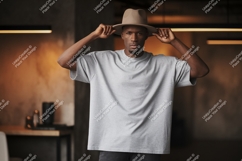 Man wearing grey t shirt and hat t-shirt fashion Product Image 1