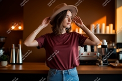Woman wearing hat and maroon t shirt image Product Image 1