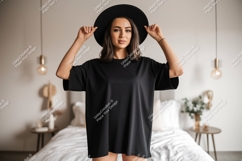 Woman wearing black t-shirt and hat indoor Product Image 1