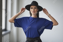 Woman wearing blue t-shirt and black hat image Product Image 1