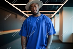 Man wearing blue t shirt and hat image Product Image 1