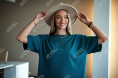 Woman wearing teal t-shirt and hat gold Product Image 1