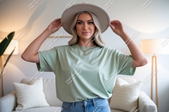Woman wearing light green t-shirt and hat casual fashion Product Image 1