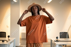 Man wearing orange t shirt and hat t-shirt fashion Product Image 1