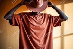 Man wearing terracotta t shirt and hat image Product Image 1