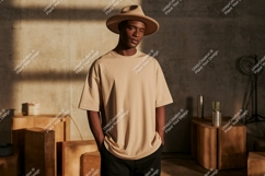 Man wearing neutral toned t shirt and hat image Product Image 1