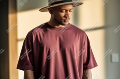Man wearing maroon t shirt and hat image Product Image 1