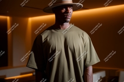 Man wearing olive green t shirt and hat image Product Image 1